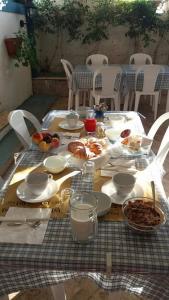 a table with plates of food on top of it at Azzurromare in San Vito Chietino