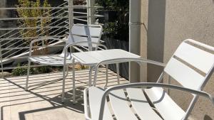 A balcony or terrace at *CENTRAL LAKESIDE APT*Swimming Pool & Free Parking