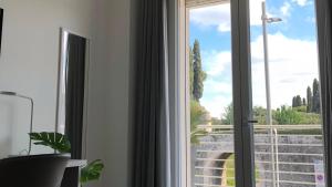 A balcony or terrace at *CENTRAL LAKESIDE APT*Swimming Pool & Free Parking