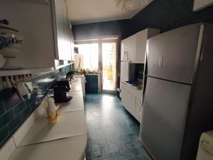 Kuchyňa alebo kuchynka v ubytovaní Attico Panoramico Vista Mare