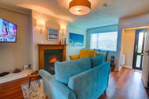 a living room with a couch and a fireplace at Garavogue Villa in Sligo