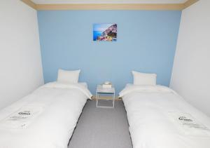 Maison Mini Hotel客房内的一张或多张床位