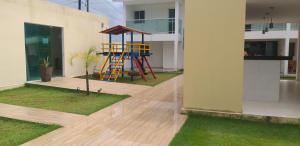 a playground in the middle of a house at Bangalô/Dúplex Jacumã Conde in Jacumã