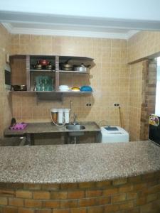 a kitchen with a sink and a counter top at 1or2 Ground Chalets 2 Bedrooms villa114 Green Beach in El Alamein