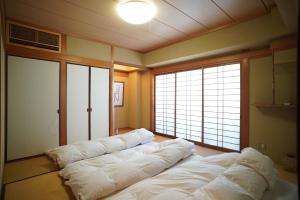 Een bed of bedden in een kamer bij Tabiyu Abrigo