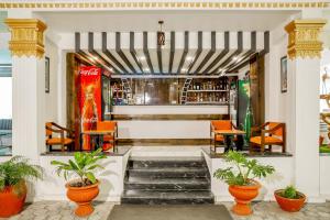 a lobby with orange chairs and a bar at Durbar Hotel & Residence in Kathmandu