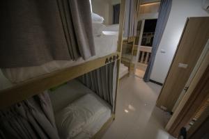 Giường trong phòng chung tại 漫時光 旅空間 ManLu INN