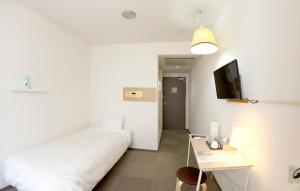 Letto o letti in una camera di Hotel Crown Hills Toyohashi