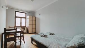 Posteľ alebo postele v izbe v ubytovaní Floriańska 10 by Homeprime