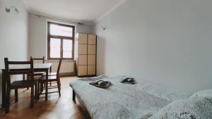 Posteľ alebo postele v izbe v ubytovaní Floriańska 10 by Homeprime
