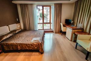 Postel nebo postele na pokoji v ubytování Family Hotel Casa del Mare