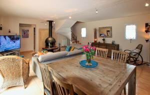 a living room with a couch and a table at VILLA FLAMENCA - piscine chauffée in Châteaurenard