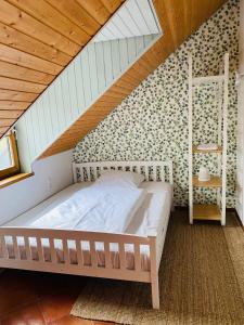 a bedroom with a bed in a attic at Oldenburger Mühle in Oldenburg