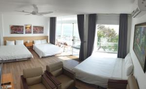 Giường trong phòng chung tại Phuong Nam Hotel Vung Tau