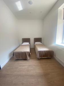 Ein Bett oder Betten in einem Zimmer der Unterkunft Sulu Hostel