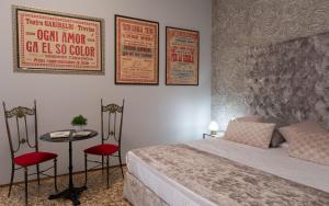 Postel nebo postele na pokoji v ubytování B&B Cà del Poeta