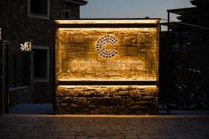 a sign for a costa discos sign on a building at Costa D' Ifesto in Agios Ioannis Kaspaka