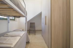 Dviaukštė lova arba lovos apgyvendinimo įstaigoje Villa Gentile-Appartamento Giusy