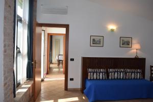A bed or beds in a room at Agriturismo Villa Selvatico