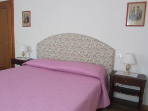 A bed or beds in a room at Agriturismo Villa Selvatico