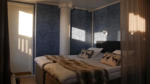 מיטה או מיטות בחדר ב-Hotel Golden Circle Suites