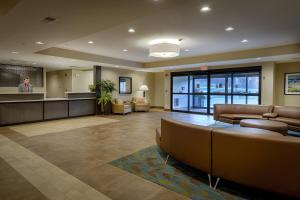 a lobby with couches and a bar in a building at Candlewood Suites Lakeville I-35, an IHG Hotel in Lakeville