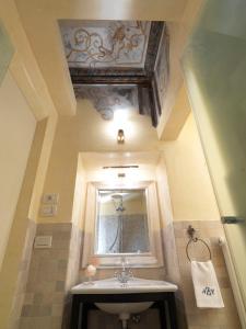 a bathroom with a sink and a mirror at Antica Casa Zucchini B&B in Bologna