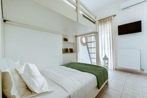A bed or beds in a room at Chania Paradise Retreat - Falasarna Villa Nostalgia