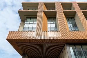a tall building with windows on the side of it at VOTRE hotel in Jounieh