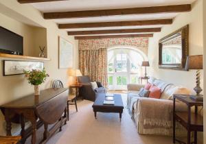 a living room with a couch and a table at Shieldhall - Cabinetmakers Suite in Morpeth