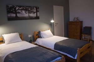 מיטה או מיטות בחדר ב-Enjoy Square - Spacious Holiday Home near Maredsous