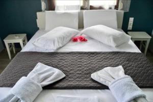 Ein Bett oder Betten in einem Zimmer der Unterkunft See Breeze Apartments - n.2
