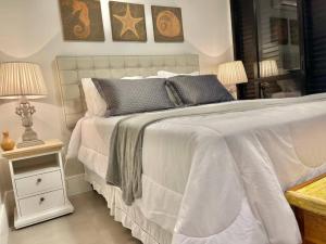Кровать или кровати в номере Frente Mar - Guarujá Enseada - Prime Experience