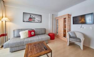 Televízia a/alebo spoločenská miestnosť v ubytovaní Hüttl Relax Appartements