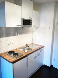 Kuchyň nebo kuchyňský kout v ubytování Ferienwohnung Khorsandi Eins