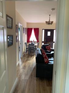 a living room with a couch and a table at Mayfield House Holiday home in Ballinrobe