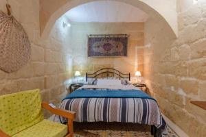 Ένα ή περισσότερα κρεβάτια σε δωμάτιο στο Ta' Frenc Farmhouse +37 φωτογραφίες