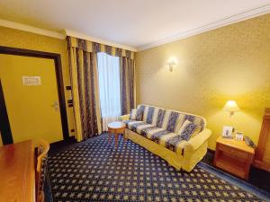 Postel nebo postele na pokoji v ubytování Hotel Ovest