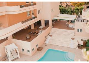 an aerial view of a house with a swimming pool at Blue Note Resort & Club in Athens