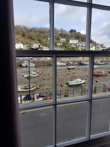 a view of a marina from a window at The Harbour Moon in Looe