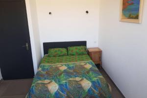 En eller flere senge i et værelse på Casevielle la villa