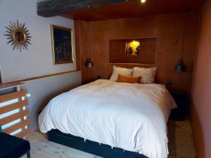Een bed of bedden in een kamer bij La Jauchelle