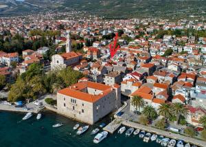 an aerial view of a city with boats in the water at Family house KAŠTELA HOME between Split and Trogir in Kaštela