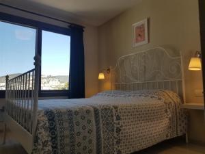 מיטה או מיטות בחדר ב-Apartment Begonville