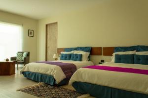 Postel nebo postele na pokoji v ubytování Hotel Nak'An Secreto Maya