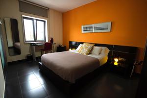 Łóżko lub łóżka w pokoju w obiekcie Hotel Los Nardos