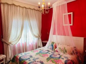 A bed or beds in a room at Vivienda Vacacional FLORATERE