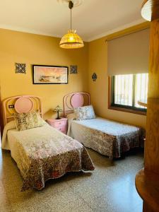 A bed or beds in a room at Vivienda Vacacional FLORATERE