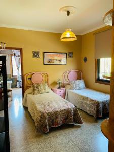 A bed or beds in a room at Vivienda Vacacional FLORATERE