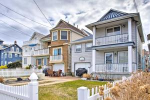 a house with a white fence in front of it at Ocean Grove Home, Visit the Beachblock and Boardwalk in Ocean Grove